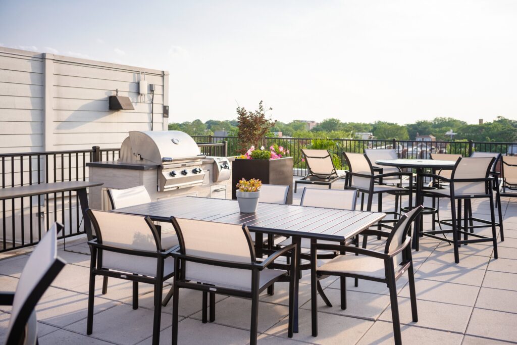 Rooftop patio with grill and tables