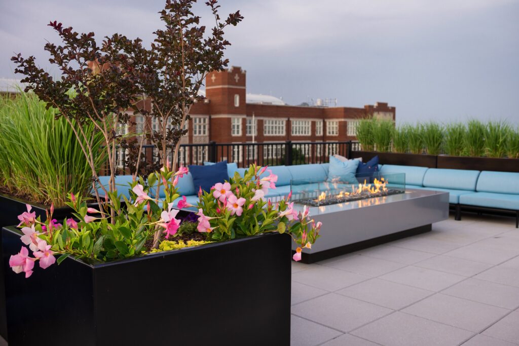 Rooftop patio with sofas and fire pit