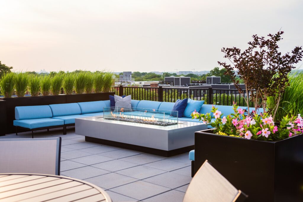 Rooftop patio with sofa and fire pit